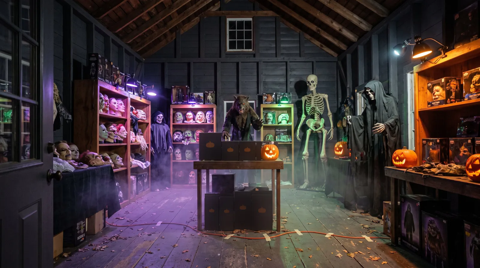 Inside the haunt shop: dark walls, shelves of masks lit green and pink, a skeleton and a hooded reaper by the counter, jack-o'-lanterns and low purple light on the floor.